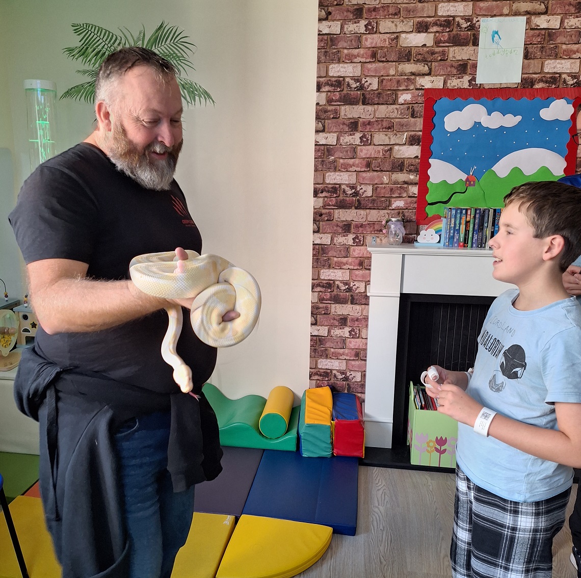 michael-tyler-from-creepy-claws-introduces-jacob-to-simon-the-royal-python.jpg